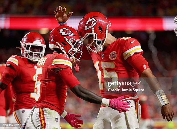 Marquise Brown and Patrick Mahomes of the Kansas City Chiefs celebrate after a touchdown against the Detroit Lions during the third quarter in the...