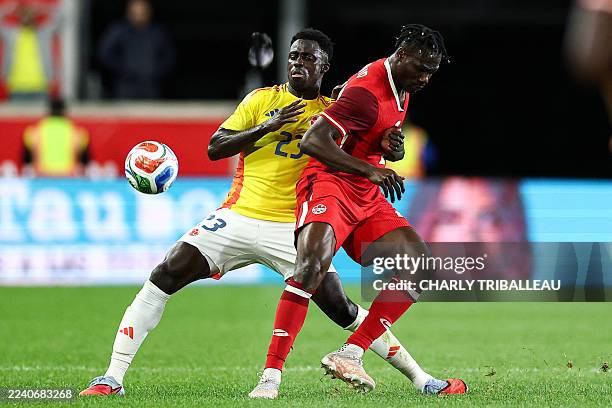 Colombia's defender Davinson Sanchez fights for the ball with Canada's forward Promise David during the international friendly football match between...