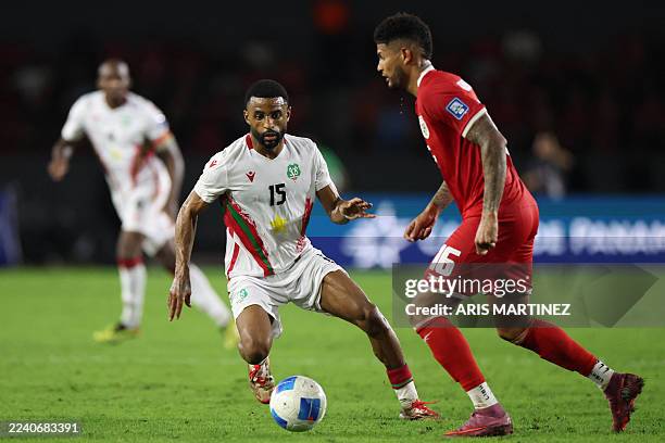 Suriname's defender Djavan Anderson and Panama's defender Andres Andrade fight for the ball during the 2026 FIFA World Cup Concacaf qualifier...