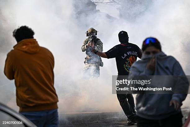 Residents and protesters clash with federal agents in the East Side neighborhood on October 14, 2025 in Chicago, Illinois. It was not immediately...