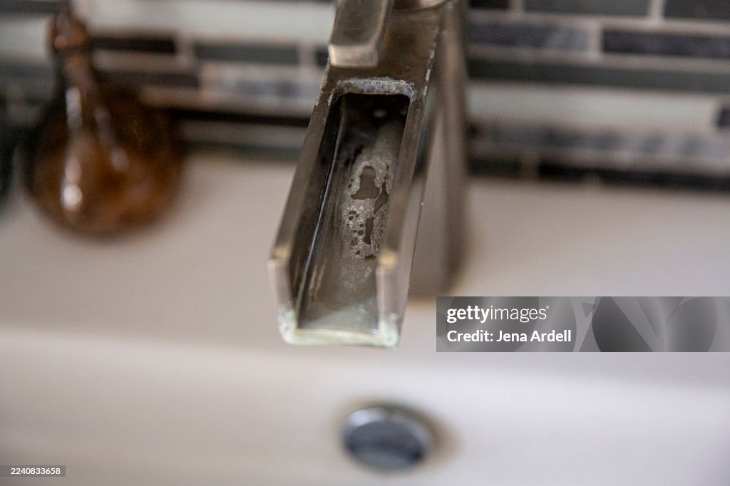 Hard Water Residue, Mineral Calcification on Sink Faucet with Calcium Buildup