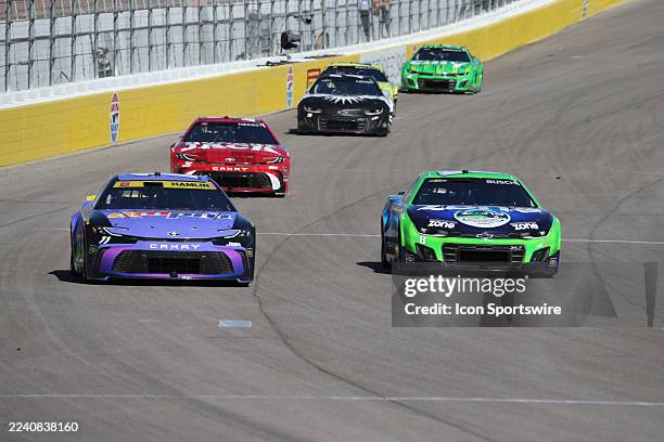 Denny Hamlin passes his old teammate Kyle Busch during the NASCAR Cup Series South Point 400 race on October 12 at Las Vegas Motor Speedway in Las...