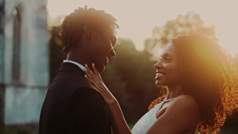 https://media.gettyimages.com/id/2240846791/video/the-bride-adjusts-the-bow-tie-around-the-sunset.jpg?b=1&s=640x640&k=20&c=tqJ_yH_JY51uv2rEJ4JYhj-RArUpOpWqXPeLFMzgtpo=