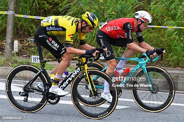 Attila Valter of Hungary and Team Visma | Lease a Bike and Mathis Le Berre of France and Team Arkea - B&B Hotels compete in the breakaway during the...