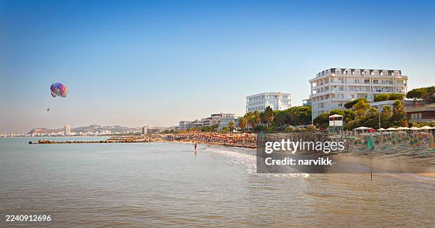 public beach at golem - albania stock pictures, royalty-free photos & images