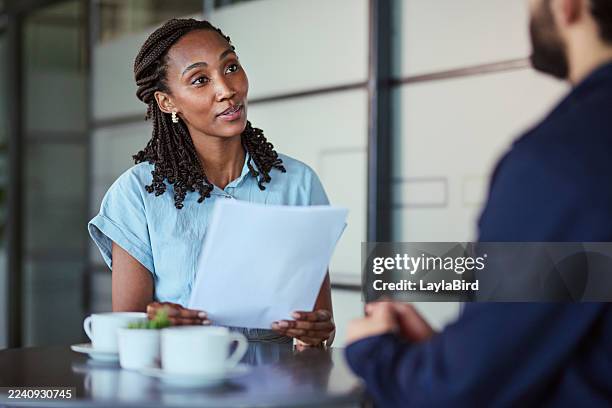 focused black female manager holding documents during interview - coffee queue stock pictures, royalty-free photos & images