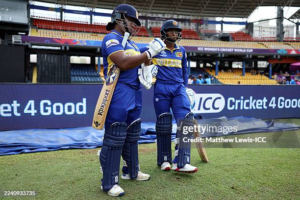 Chamari Athapaththu and Vishmi Gunaratne of Sri Lanka prepare to bat during the ICC Women's Cricket World Cup India 2025 match between New Zealand...