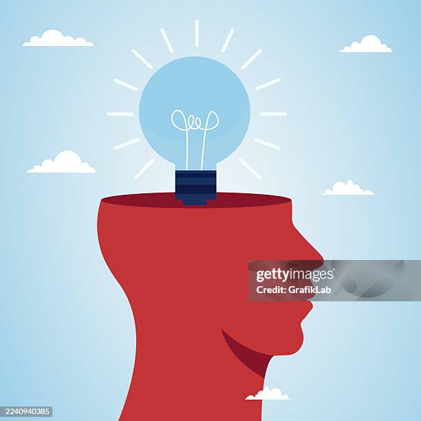 creative concept illustration with lightbulb above a red human profile - rethinking stock illustrations