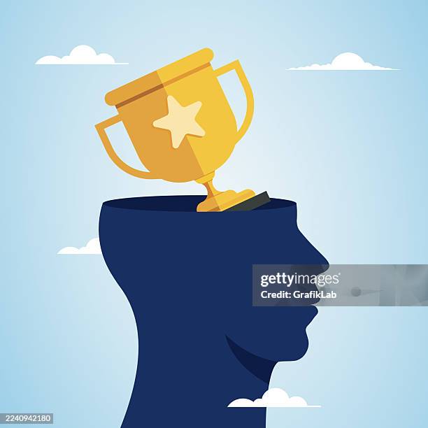 silhouette head with golden trophy symbolizing success and achievement - resilience stock illustrations