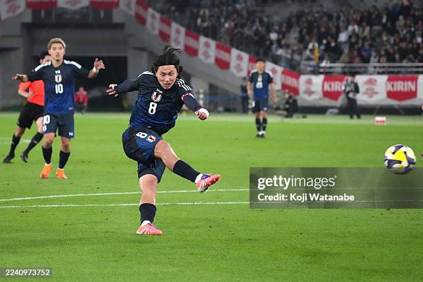 Takumi Minamino of Japan scores the team's first goal during the international friendly match between Japan and Brazil at Tokyo Stadium on October...