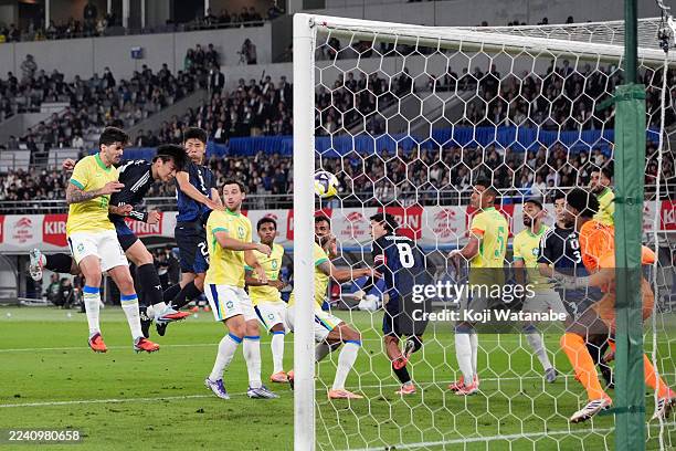Ayase Ueda of Japan heads to score the team's third goal during the international friendly match between Japan and Brazil at Tokyo Stadium on October...