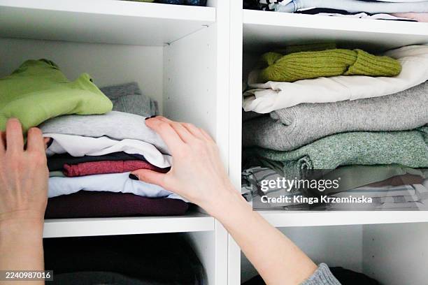 decluttering - warm clothing stock pictures, royalty-free photos & images