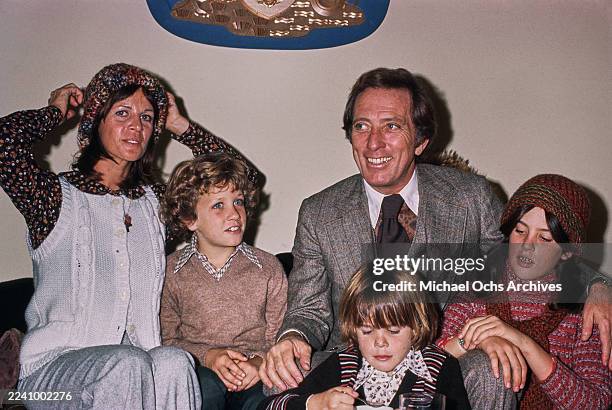 Franco-American singer, actress and dancer Claudine Longet, wearing a white knitted waistcoat over a patterned blouse and a knitted hat, and her...