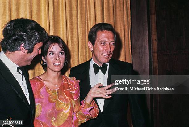 American composer, songwriter and pianist Burt Bacharach, wearing a tuxedo and bow tie, Franco-American singer, actress and dancer Claudine Longet,...