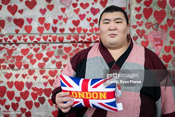 Atamifuji poses during a tour of central London during previews to the Grand Sumo Tournament on October 14, 2025 in London, England. This will be the...