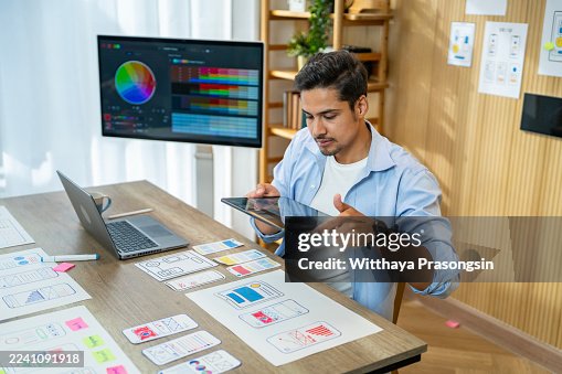 Man prototyping mobile app user interface design Man prototyping mobile app user interface design