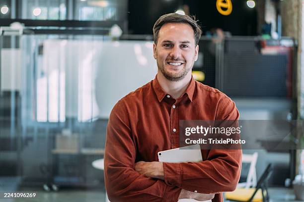 confident businessman in modern office. - director stock pictures, royalty-free photos & images