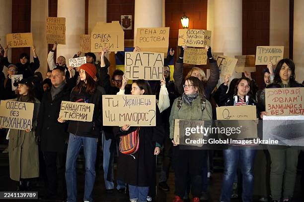 People hold banners at a rally against Odesa Mayor Hennadii Trukhanov in the city centre on October 14, 2025 in Odesa, Ukraine. On October 14,...