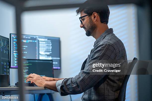 engineer developing mobile app security with multiple screens. - python code stock pictures, royalty-free photos & images