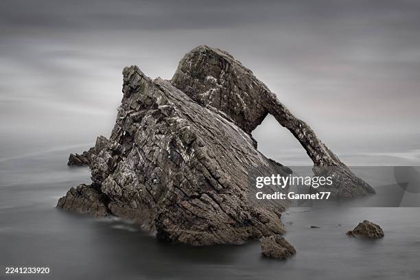 bow fiddle rock, portknockie, scotland - bow fiddle rock stock pictures, royalty-free photos & images