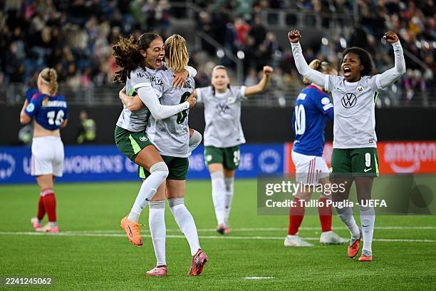 Janina Minge of VfL Wolfsburg celebrates with teammates after scoring her team's second goal from the penalty-spot during the UEFA Women's Champions...
