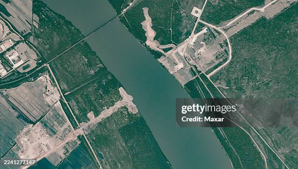 Vantor Satellite imagery shows construction activity for the new RussiaNorth Korea road bridge over the Tumen River. Visible features include...