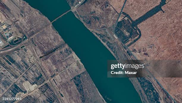 Vantor Satellite imagery documents early-stage works for the planned road bridge across the Tumen River at the TumangangKhasan crossing. Earthmoving...