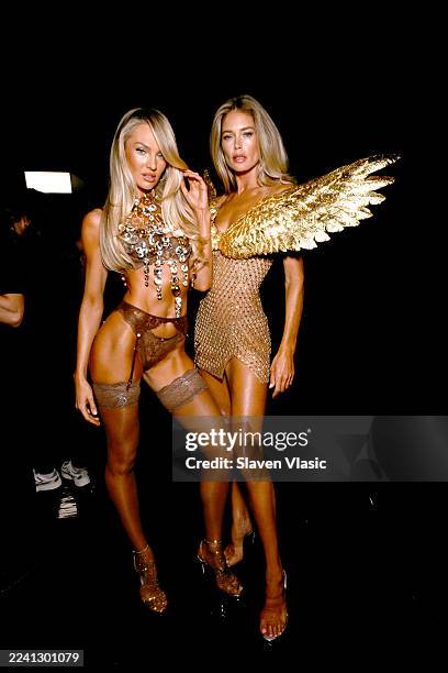 Candice Swanepoel and Doutzen Kroes pose backstage for Victoria's Secret Fashion Show 2025 on October 15, 2025 in New York City.