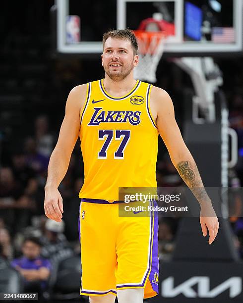 Luka Doncic of the Los Angeles Lakers looks on during the first half of the preseason NBA game against the Phoenix Suns at Mortgage Matchup Center on...