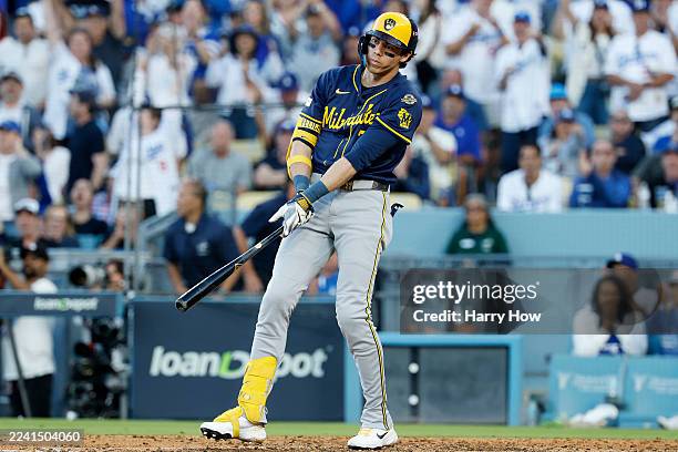 Christian Yelich of the Milwaukee Brewers reacts after striking out in the eighth inning against the Los Angeles Dodgers in game three of the...