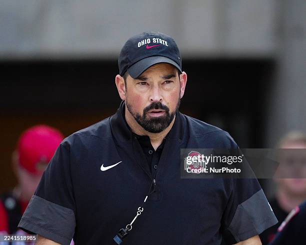 On October 18 in Madison, Wisconsin, USA, Ohio State Buckeyes head coach Ryan Day stands before a college football game between the Wisconsin Badgers...