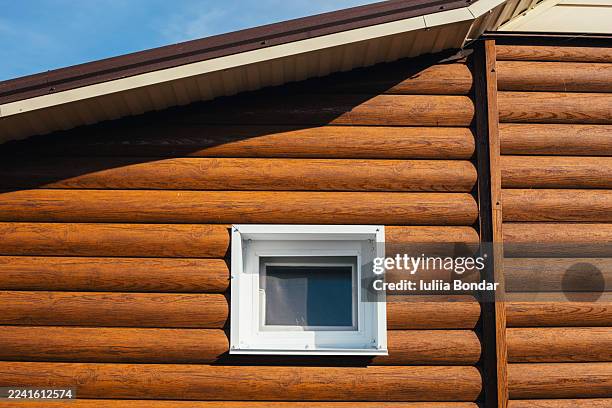 wooden house facade with small window - small home exterior stock pictures, royalty-free photos & images