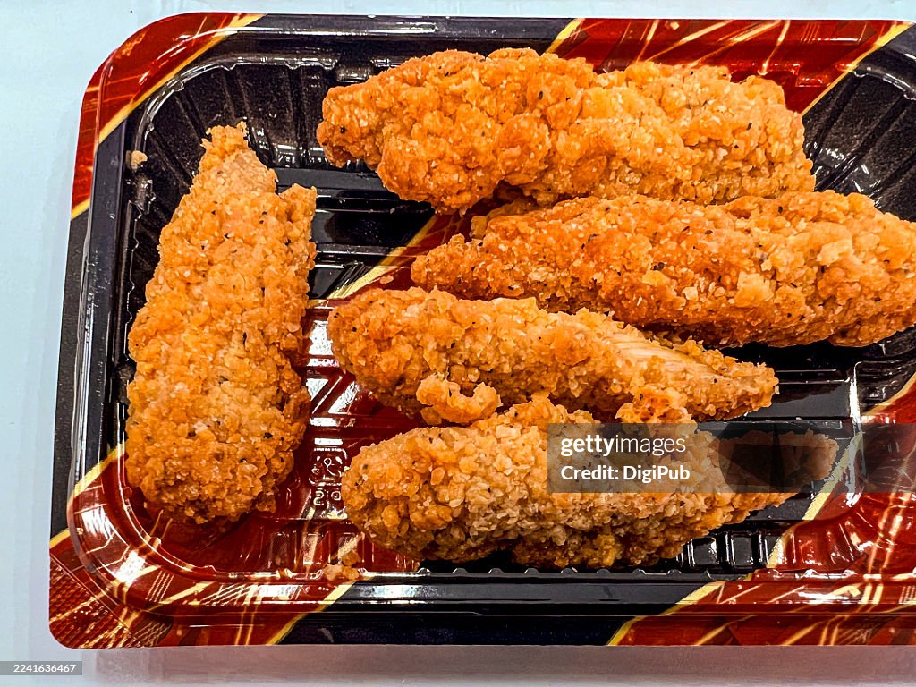 Crispy Fried Chicken Tenders in a Plastic Disposable Tray