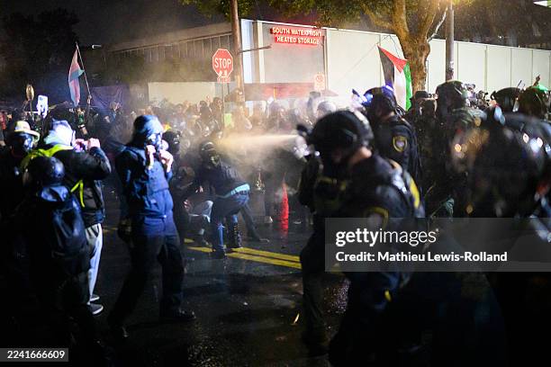 Anti-I.C.E. Protesters clash with federal agents at the U.S. Immigration and Customs Enforcement building on October 18, 2025 in Portland, Oregon....