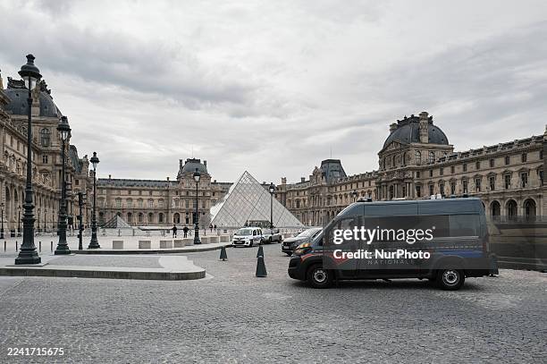 French police officers stand in front of the Louvre Museum after a robbery in Paris, France, on October 19, 2025. Robbers break into the Louvre and...