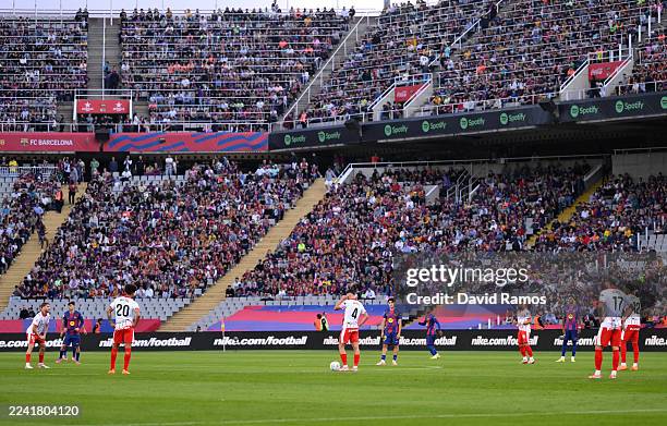 Players stand still during the first fifteen seconds of the match in protest at the decision to play a La Liga game in Miami during the LaLiga EA...