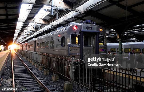 Passengers disembark from an NJ Transit commuter train that arrived at the Hoboken transit terminal on October 16 in Hoboken, New Jersey.
