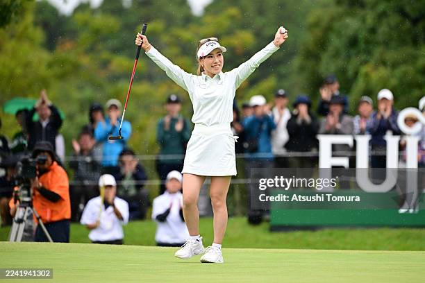 Ayako Kimura of Japan celebrates winning the tournament on the 18th green during the final round of Fujitsu Ladies Golf Tournament at Tokyu Seven...