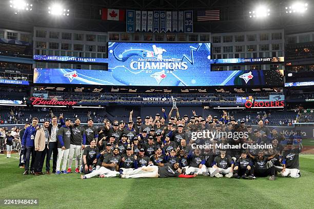 Members of the Toronto Blue Jays pose for a team photo after Game Seven of the American League Championship Series presented by Booking.com between...