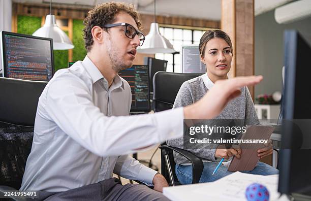 couple, software engineer developer use computer, work on program coding together at the office. programming language development technology, freelance job concept - python code stock pictures, royalty-free photos & images