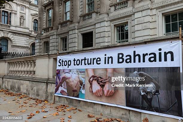 Banner reading 'Stop torture in Bahrain' is positioned against a wall close to Downing Street during a small protest in Whitehall by Bahrain Freedom...