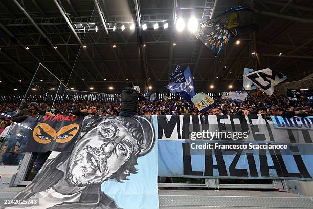 Fans of Lazio wave flags from the stands prior to the Serie A match between Atalanta BC and SS Lazio at Gewiss Stadium on October 19, 2025 in...