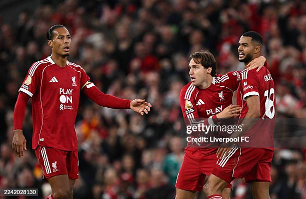 Cody Gakpo of Liverpool celebrates scoring his team's first goal with teammates Virgil van Dijk and Federico Chiesa during the Premier League match...