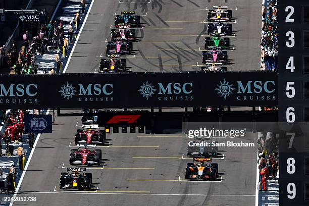 Max Verstappen of the Netherlands driving the Oracle Red Bull Racing RB21 and Lando Norris of Great Britain driving the McLaren MCL39 Mercedes lead...