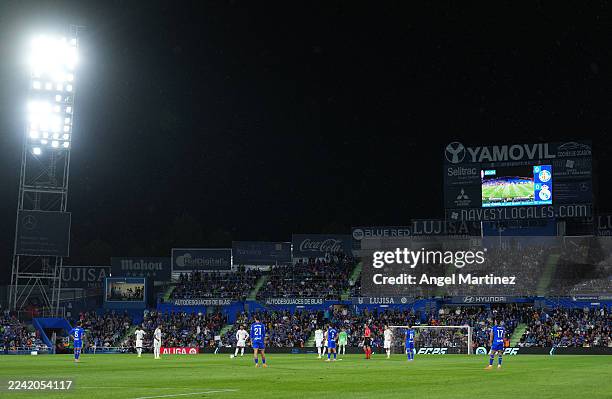 General view of the inside of the stadium as players of Getafe CF and Real Madrid stand still for the first fifteen seconds of the match, as they...