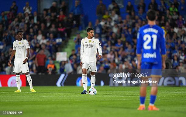 Jude Bellingham of Real Madrid looks on as he waits to kick off the match as players of Getafe CF and Real Madrid stand still for the first fifteen...