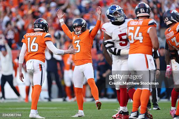Wil Lutz of the Denver Broncos celebrates after kicking a game winning field goal against the New York Giants in the fourth quarter of a game at...