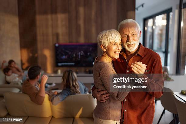 happy senior couple enjoying in a dance at home. - couple dancing stock pictures, royalty-free photos & images