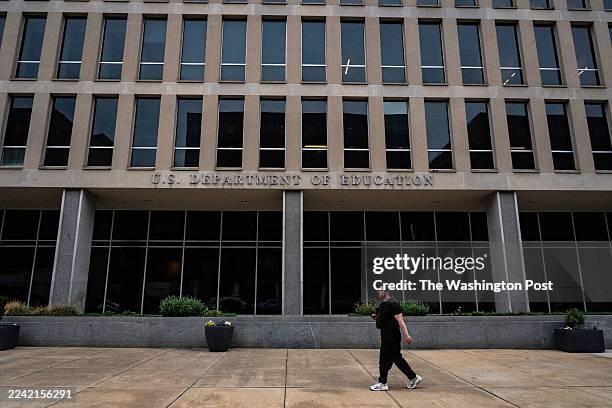 Person walk past the U.S. Department of Education in Washington, DC, on September 30, 2025.