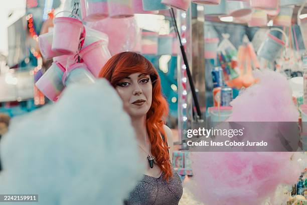 ginger girl buying cotton candy - cotton candy stock pictures, royalty-free photos & images